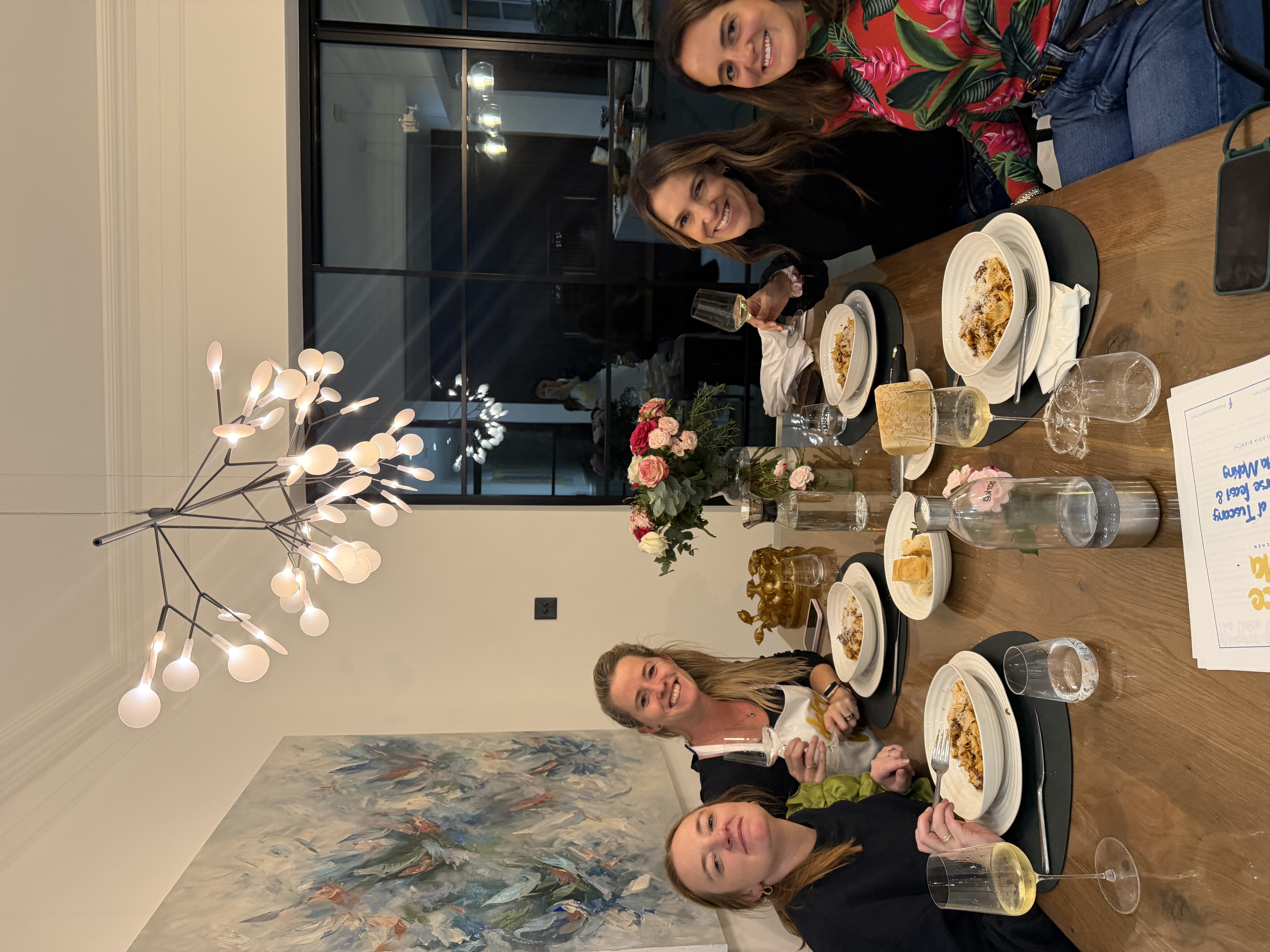 Guests enjoying dinner and wine at The Dolce Vita Kitchen